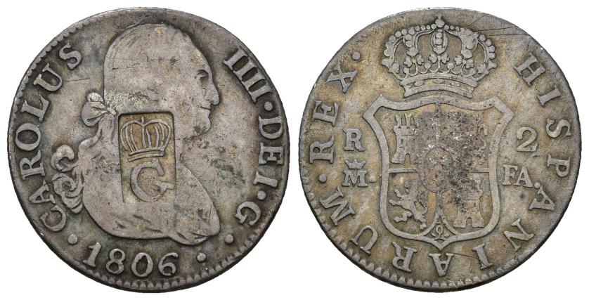 280   -  FERNANDO VII. Guadalupe. Resello de G coronada dentro de rectángulo vertical sobre 2 reales 1806 Madrid FA. AR 5,50 g. 25,5 mm. KM-no. El resello MBC.