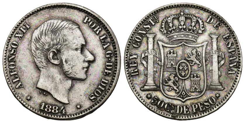 342   -  ALFONSO XII. 50 centavos de peso. 1884. Manila. AR 12,84 g. 29,8 mm. VII-79. Limpiada. MBC. Escasa.