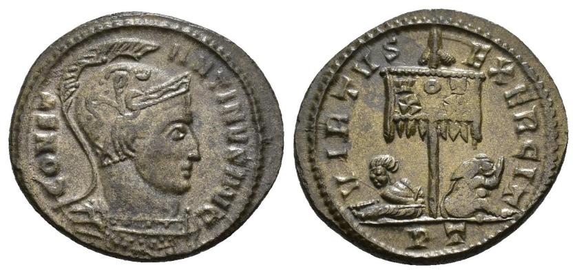 447   -  IMPERIO ROMANO. CONSTANTINO I. Follis. Ticinum (319-320). A/ Busto con casco y coraza a der.; CONST-ANTINVS AVG. R/ Estandarte con VOT/XX flanqueado por dos cautivos; VIRTVS EXERCIT, exergo PT. AE 3,41 g. 19,9 mm. RIC-14. EBC-. 