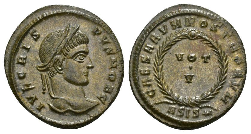 452   -  IMPERIO ROMANO. CRISPO. Follis. Siscia (320-321). A/ Cabeza laureada a der.; IVL CRISPVS NOB C. R/ Láurea rodeando VOT/./V; CAESARVM NOSROTRVM, exergo ASIS*. AE 3,52 g. 20,1 mm. RIC-161. EBC+. 