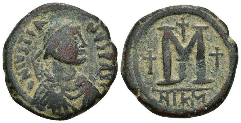 467   -  IMPERIO BIZANTINO. JUSTINO II. Follis. Nicomedia. a/ Ley. D N IVSTIA-NVS P AV(G). R/ M flanqueada por cruces, exergo NIKM, oficina B? AE 17,39 g. 30,6 mm. SBB-88 vte. MBC-. . SBB-369.