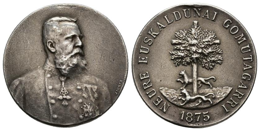 517   -  MEDALLAS CARLISTAS. Neure Euskaldunai Gomutagarri. 1875. Metal blanco 8,81 g. 28,48 mm. Grabador: JAUNER. Sin su anilla. MBC/MBC+.