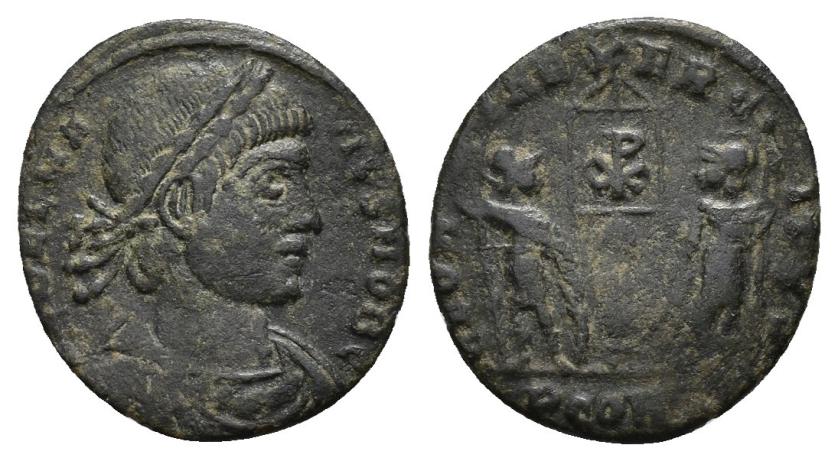 3179   -  IMPERIO ROMANO. DALMACIO. Follis. Arelate (336). A/ Busto laureado, drapeado y acorazado a der.; (FL)DELMATIVS NOB C. R/ Dos soldados flanqueando estandarte con crismón; GLORIA EXERCITVS (poco visible). -/-//PCON(-). AE 1,22 g. 15,8 mm. RIC-399. MBC-. 