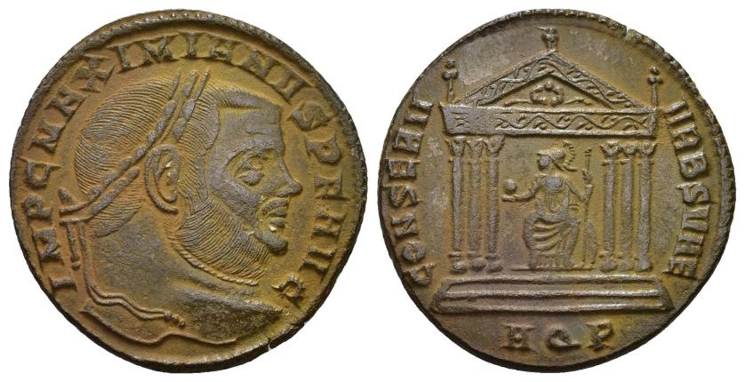 2400   -  IMPERIO ROMANO. MAXIMIANO. Follis. Aquileia (307). A/ Cabeza laureada a der.; IMP C MAXIMIANVS P F AVG. R/ Roma sentada dentro de templo hexástilo; CONSERV VRBS SVAE. -//AQP. AE 6,08 g. 26 mm. RIC-118. MBC.