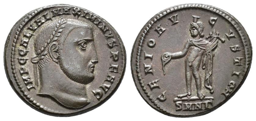 2419   -  IMPERIO ROMANO. MAXIMINO. Follis. Nicomedia (310-311). A/ Cabeza laureada a der.; IMP C GAL VAL MAXIMINVS P F AVG. R/ Genio a izq. con pátera y cornucopia; GENIO AVGVSTI. -//SMNG. AE 7,34 g. 23,4 mm. RIC-66c. MBC+/EBC-.