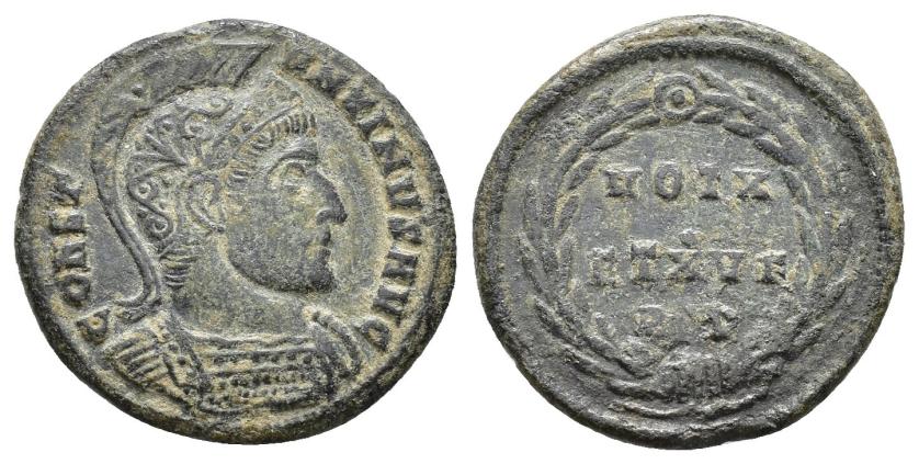 2428   -  IMPERIO ROMANO. CONSTANTINO. Follis. Roma (320). A/ Busto con casco y coraza a der.; CONSTANTINVS AVG. R/ Láurea rodeando VOT X/ET XV F. -/-//RT(?). AE 2,93 g. 19,9 mm. RIC-207. MBC-/BC+. Muy escasa.