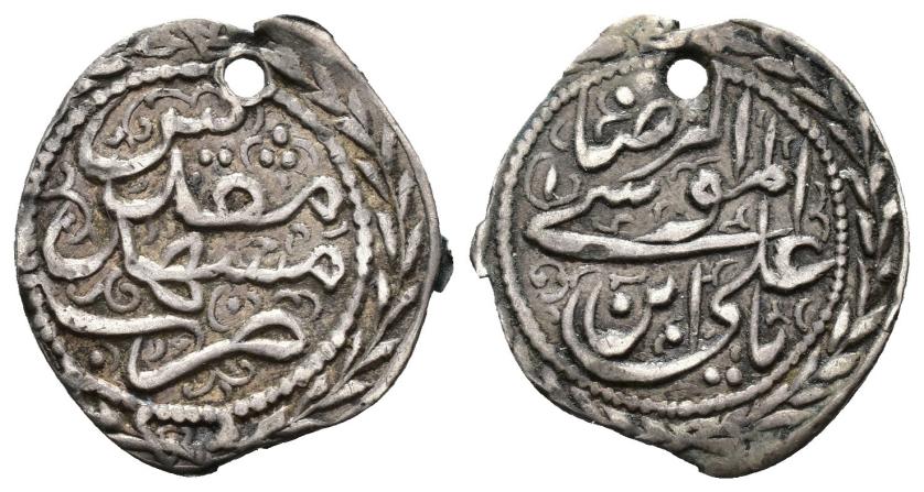 1259   -  KAYARÍES DE IRÁN. Objeto monetiforme a nombre de  'Ali B. Musà al-RidaA ("reza"), 8º imam. Mashad Mugaddas. Sin fecha. CU 0,66 g. 16 mm.Perforación. MBC.